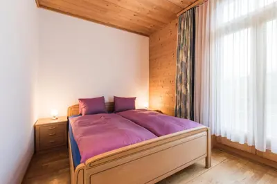 Ein Bett oder Betten in einem Zimmer der Unterkunft Hotel Alpenrose beim Ballenberg