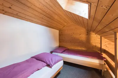 Ein Bett oder Betten in einem Zimmer der Unterkunft Hotel Alpenrose beim Ballenberg