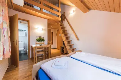 Ein Bett oder Betten in einem Zimmer der Unterkunft Hotel Alpenrose beim Ballenberg