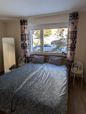 Ein Bett oder Betten in einem Zimmer der Unterkunft Alpine Siesta