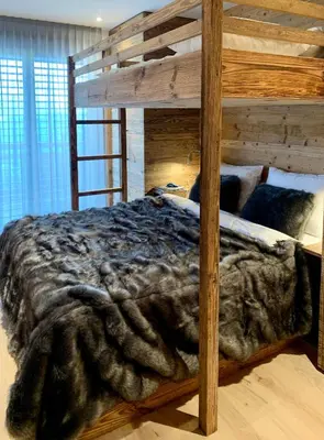 Ein Bett oder Betten in einem Zimmer der Unterkunft Luxury chalet apartment 4 Valleys