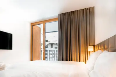 Ein Bett oder Betten in einem Zimmer der Unterkunft Gotthard Hotel Apartment