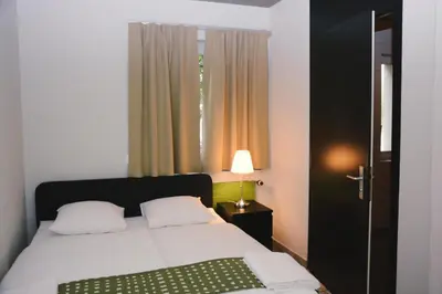 Ein Bett oder Betten in einem Zimmer der Unterkunft Alaïa Hostel