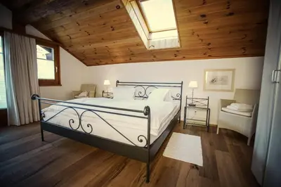 Ein Bett oder Betten in einem Zimmer der Unterkunft Villa Taugwalder I Wohnung Matterhorn
