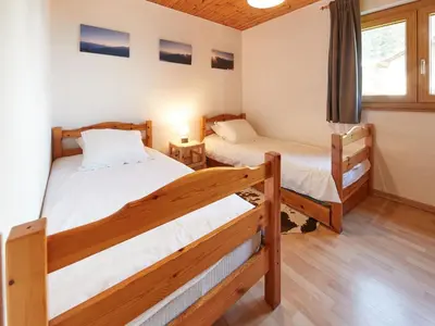 Ein Bett oder Betten in einem Zimmer der Unterkunft Chalet Fuchsia by Interhome