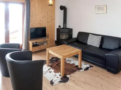 Ein Sitzbereich in der Unterkunft Chalet Fuchsia by Interhome