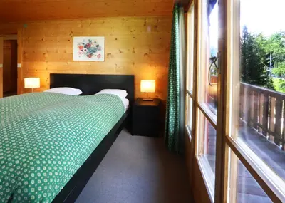 Ein Bett oder Betten in einem Zimmer der Unterkunft Chalet les Mayens