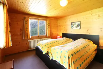 Ein Bett oder Betten in einem Zimmer der Unterkunft Chalet les Mayens