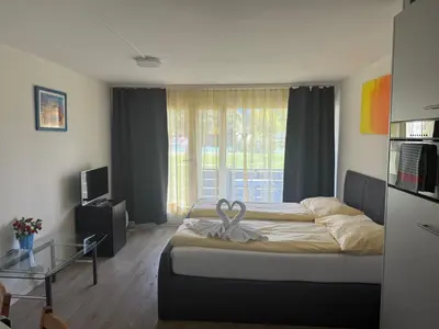 Ein Bett oder Betten in einem Zimmer der Unterkunft Studio 102 - Riverside