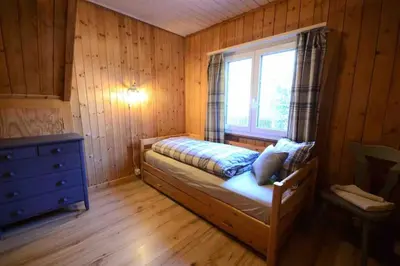 Ein Bett oder Betten in einem Zimmer der Unterkunft Swiss Traditional Chalet with Alpine Mtn View
