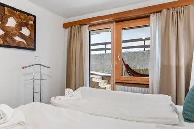 Ein Bett oder Betten in einem Zimmer der Unterkunft Centre de Saas-Fee - 2 chambres - balcon & patio