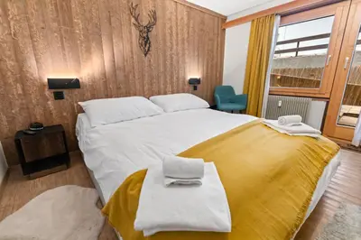 Ein Bett oder Betten in einem Zimmer der Unterkunft Centre de Saas-Fee - 2 chambres - balcon & patio