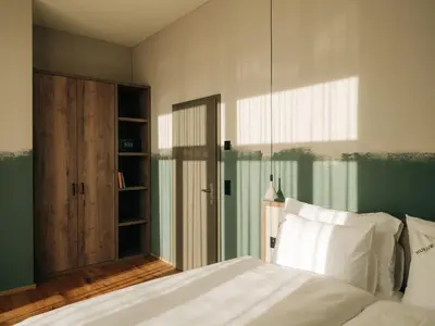 Ein Bett oder Betten in einem Zimmer der Unterkunft KURVE Apartments & Lounge