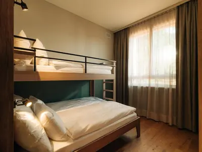 Ein Bett oder Betten in einem Zimmer der Unterkunft KURVE Apartments & Lounge