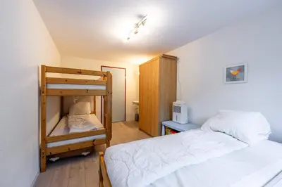 Ein Bett oder Betten in einem Zimmer der Unterkunft Large Apartment In The Vacation Center Whirlpool