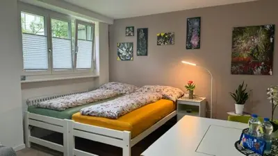 Ein Bett oder Betten in einem Zimmer der Unterkunft HEART Studio Visp Zentrum I ruhig I Single I Paare I Küche