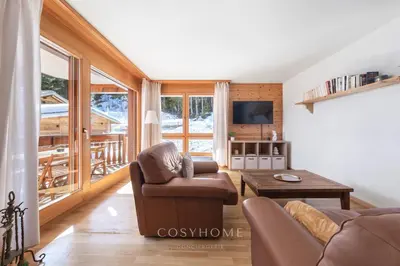 TV/Unterhaltungsangebot in der Unterkunft La Maison Lou l Ski in-out l Parking l By CosyHome