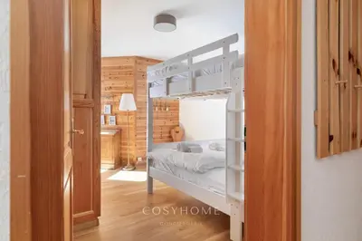 Ein Bett oder Betten in einem Zimmer der Unterkunft La Maison Lou l Ski in-out l Parking l By CosyHome