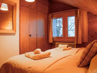 Ein Bett oder Betten in einem Zimmer der Unterkunft Chalet Crettamour by Interhome