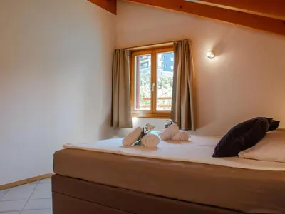Ein Bett oder Betten in einem Zimmer der Unterkunft Holiday Home Chalet Mirabelle by Interhome