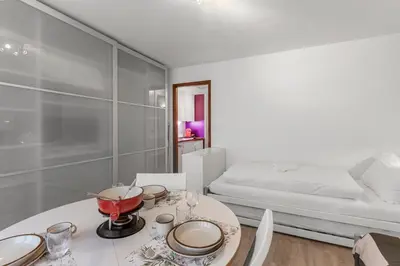 Ein Bett oder Betten in einem Zimmer der Unterkunft Studio chaleureux avec terrasse