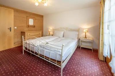 Ein Bett oder Betten in einem Zimmer der Unterkunft Ferienapartments Chalet Solvay