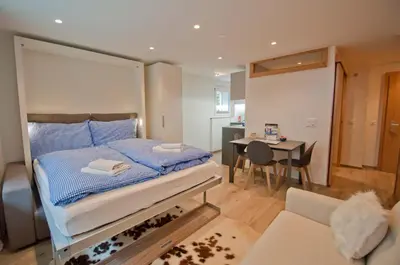Ein Bett oder Betten in einem Zimmer der Unterkunft Studio Aosta