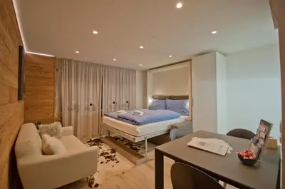 Ein Bett oder Betten in einem Zimmer der Unterkunft Studio Aosta