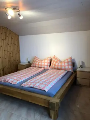 Ein Bett oder Betten in einem Zimmer der Unterkunft Haus Märzenhof
