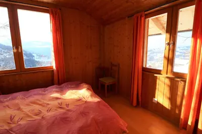 Ein Bett oder Betten in einem Zimmer der Unterkunft Chalet Les Pyramides