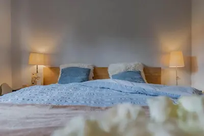 Ein Bett oder Betten in einem Zimmer der Unterkunft Wohnung Homely - Nähe Grindelwald Terminal