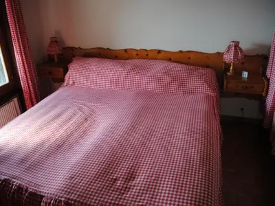 Ein Bett oder Betten in einem Zimmer der Unterkunft Residence Cransalpin