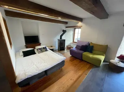 Ein Bett oder Betten in einem Zimmer der Unterkunft La Grande Majorie de Nendaz
