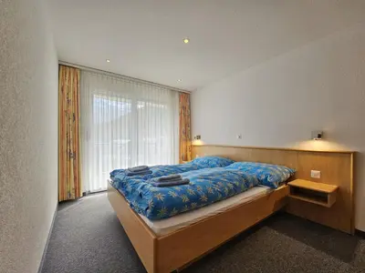 Ein Bett oder Betten in einem Zimmer der Unterkunft Nicoletta