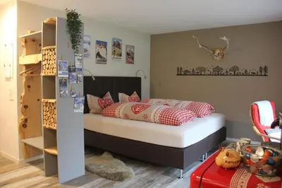 Ein Bett oder Betten in einem Zimmer der Unterkunft Bergwohl