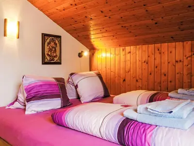 Ein Bett oder Betten in einem Zimmer der Unterkunft Chalet Dominic by Interhome