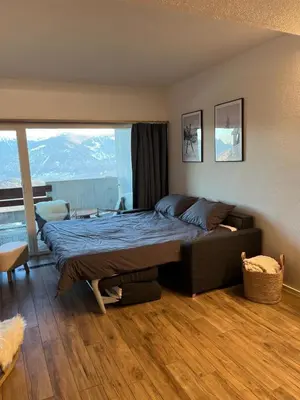Ein Bett oder Betten in einem Zimmer der Unterkunft Studio élégant rénové avec vue à Anzère