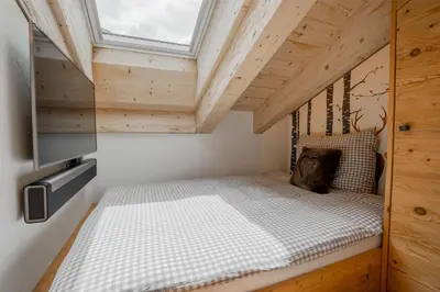 Ein Bett oder Betten in einem Zimmer der Unterkunft Akelei Penthouse by HomeFlow