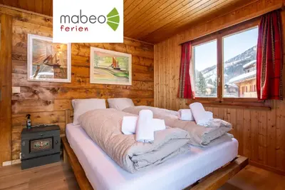 Ein Bett oder Betten in einem Zimmer der Unterkunft Chalet Daheim - Ferienwohnung OG
