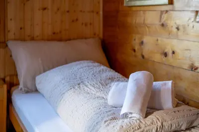 Ein Bett oder Betten in einem Zimmer der Unterkunft Chalet Daheim - Ferienwohnung OG