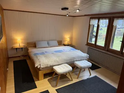 Ein Bett oder Betten in einem Zimmer der Unterkunft Enzian 4 Zi Ferienwohnung in Landhaus