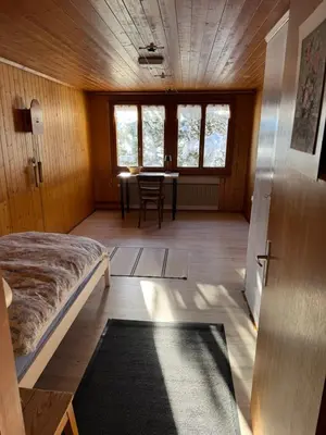 Ein Bett oder Betten in einem Zimmer der Unterkunft Enzian 4 Zi Ferienwohnung in Landhaus
