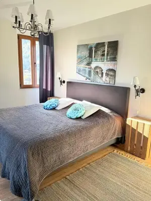 Ein Bett oder Betten in einem Zimmer der Unterkunft Appartement 70m2, entrée autonome, lit 180x200, terrasse privée, parking gratuit