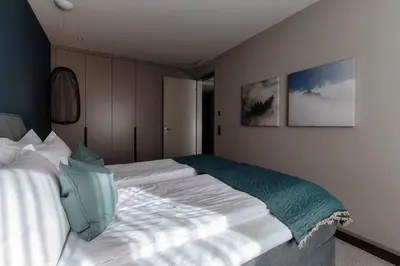 Ein Bett oder Betten in einem Zimmer der Unterkunft Andermatt Arve Relax by Quokka 360