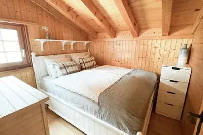 Ein Bett oder Betten in einem Zimmer der Unterkunft Chalet Domino