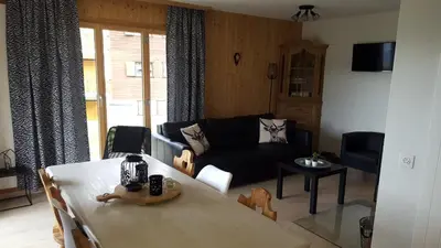 Ein Sitzbereich in der Unterkunft Gentianes COSY & MOUNTAIN apartments