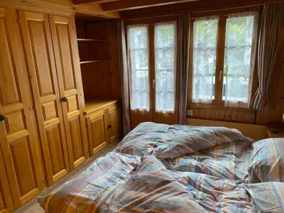 Ein Bett oder Betten in einem Zimmer der Unterkunft Le Manoir d'Anniviers