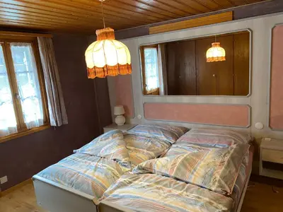 Ein Bett oder Betten in einem Zimmer der Unterkunft Le Manoir d'Anniviers