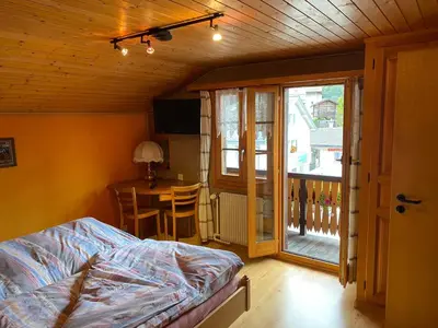 Ein Bett oder Betten in einem Zimmer der Unterkunft Le Manoir d'Anniviers