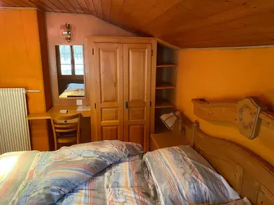 Ein Bett oder Betten in einem Zimmer der Unterkunft Le Manoir d'Anniviers